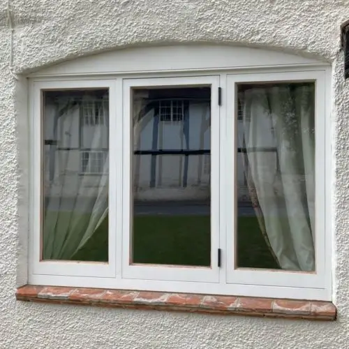 Traditional Casement Sash Window. Manufactured from Accoya. Finished in White Top Coat. 14mm Heritage Planitherm Glazed Units.
Reclaimed Tiles installed to the underside of the window.  image