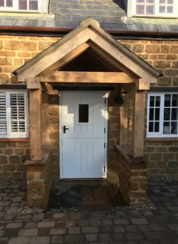 Oak Porch along with a Stable Door Finished in a White top coat with a Glazed aperture image