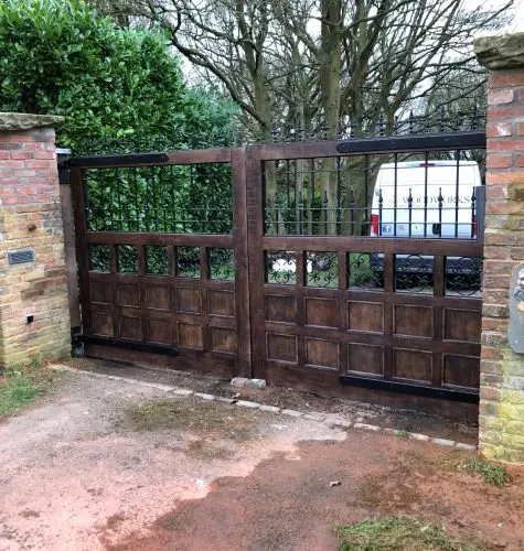 Tudor style Oak gates with hammered black ironmongery image
