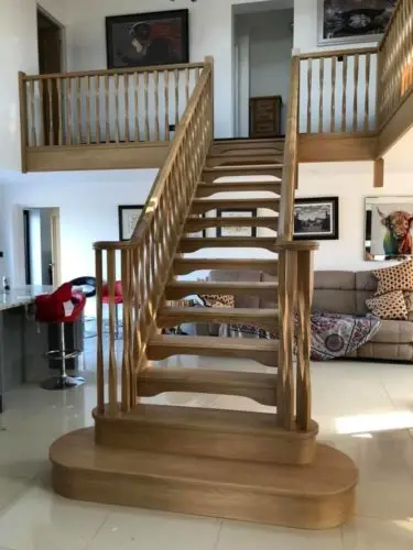 Oak Staircase with Volute Handrail, Double Bullnose bottom treads and 180 Degree twist Spindles image