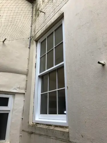 Traditional Sliding Sash Window - 
Traditional lead weight and putty glazed heritage units.
Made to specifications to match the listing requirements. 
Finished in exterior top coat. image